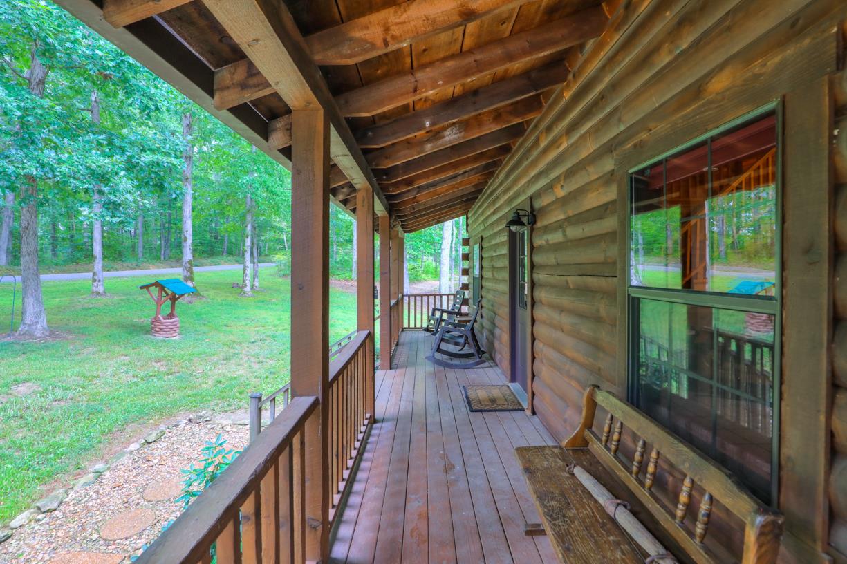 6407 Tom Rail Road Primm Springs, TN 38476 - Photo 3 of 23 a view of a deck with a backyard