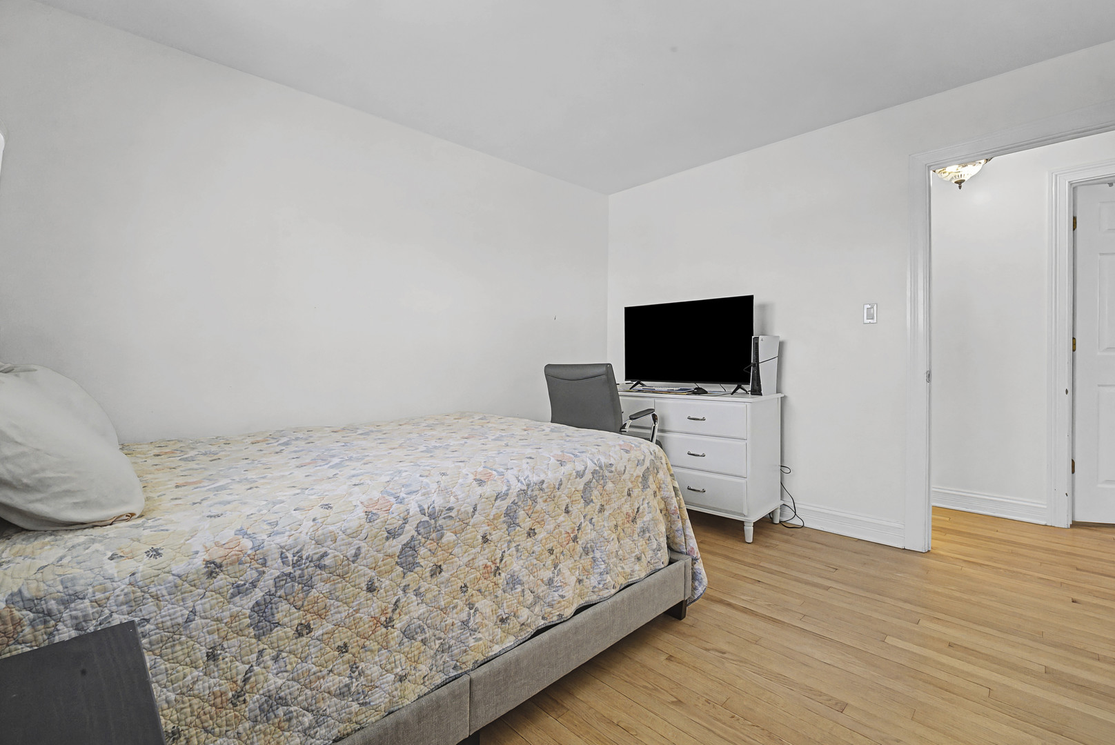 102 South Adeline Avenue Addison, IL 60101 - Photo 14 of 20 a bedroom with a bed and a flat screen tv