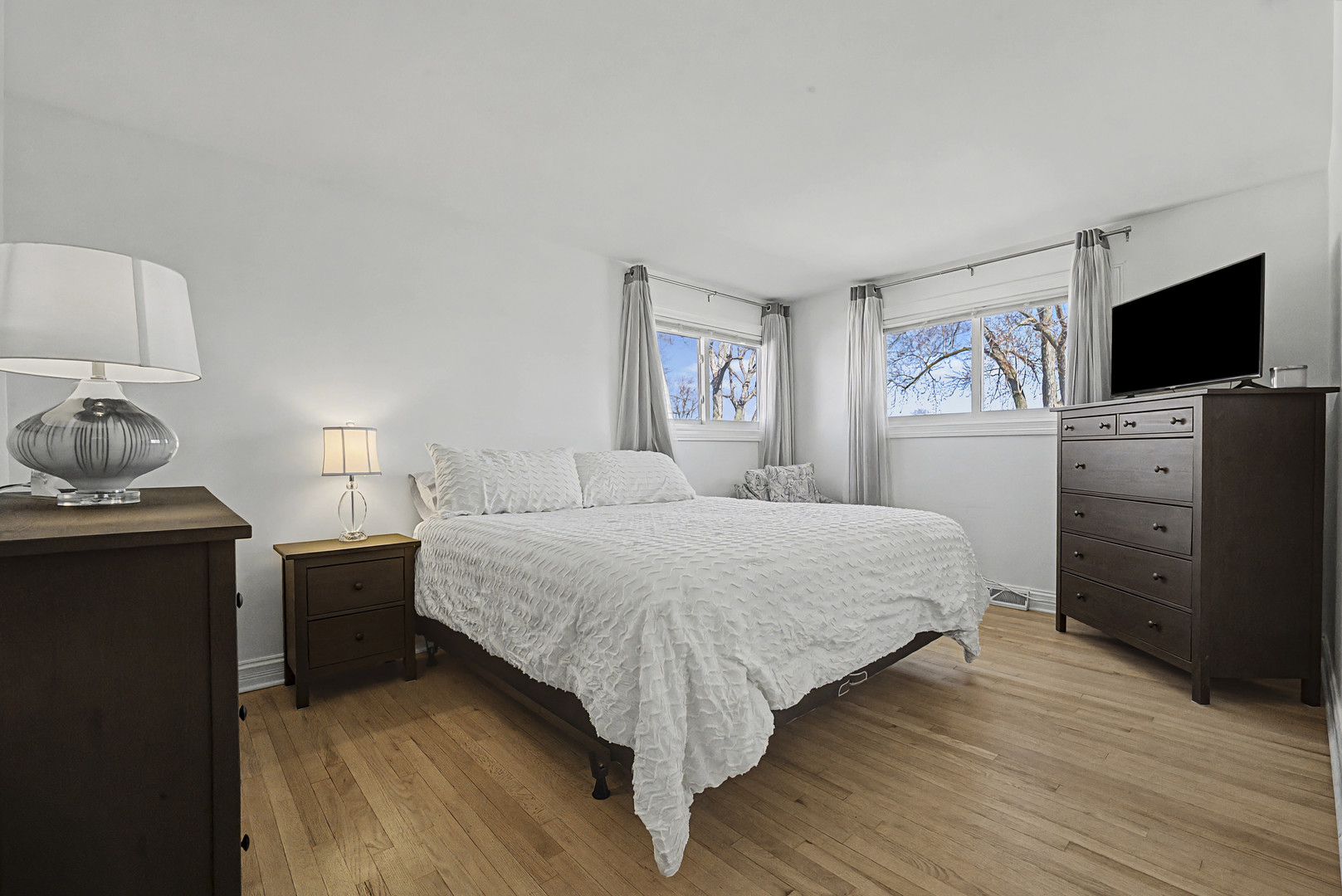 102 South Adeline Avenue Addison, IL 60101 - Photo 15 of 20 a bedroom with a bed and flat screen tv