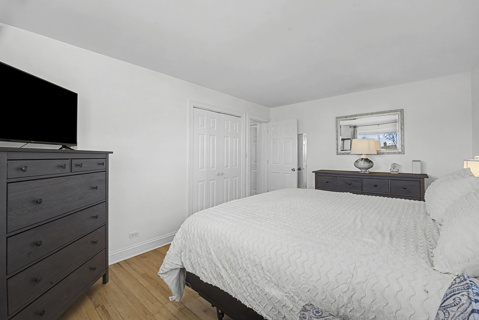 102 South Adeline Avenue Addison, IL 60101 - Photo 16 of 20 a bedroom with a bed and a flat screen tv