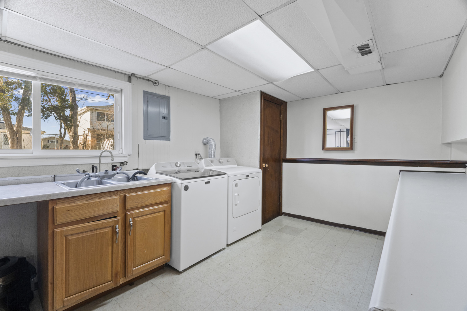 102 South Adeline Avenue Addison, IL 60101 - Photo 18 of 20 a view of a kitchen with sink cabinets and window