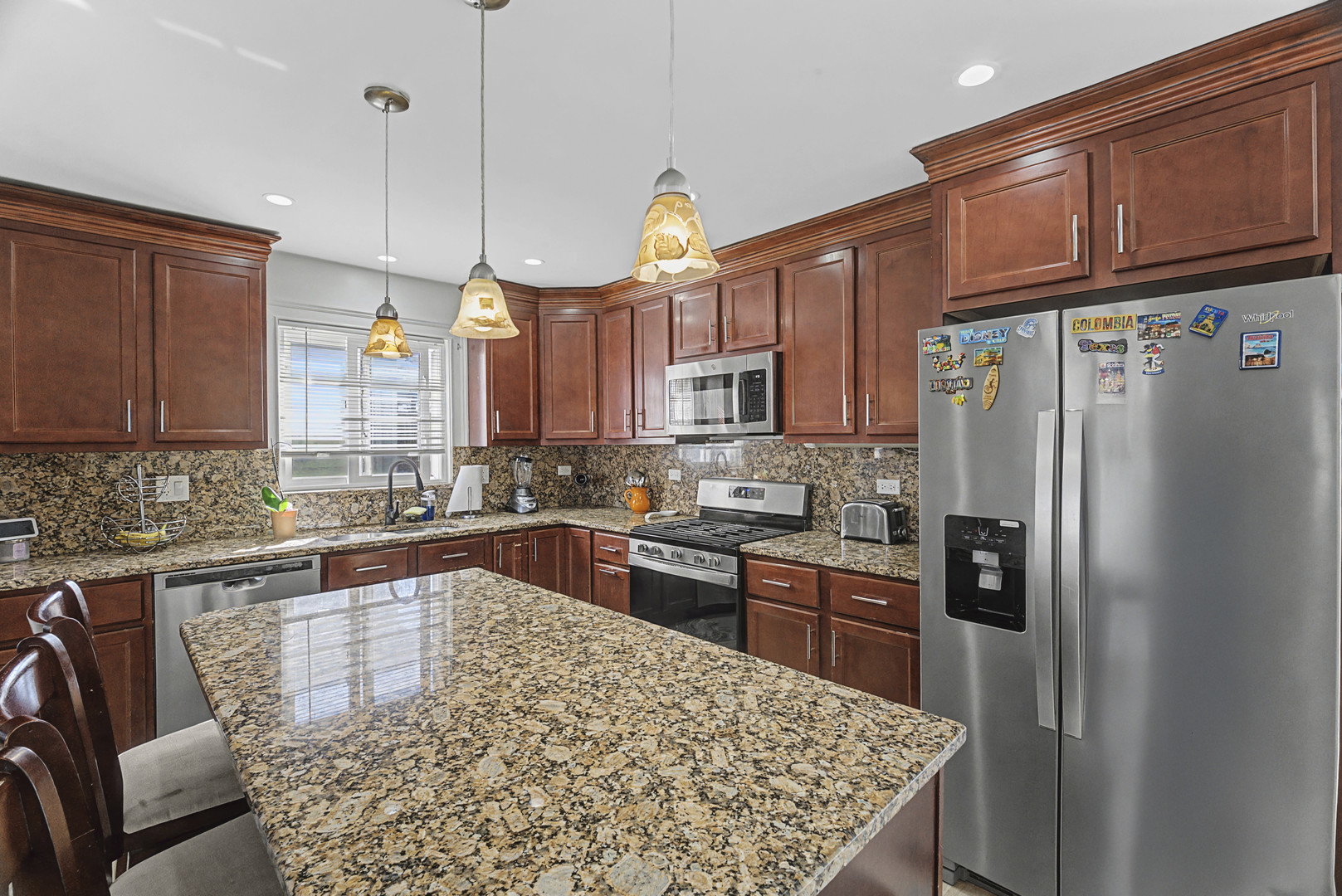 102 South Adeline Avenue Addison, IL 60101 - Photo 4 of 20 a kitchen with stainless steel appliances granite countertop a refrigerator a sink dishwasher a stove and a refrigerator with wooden floor