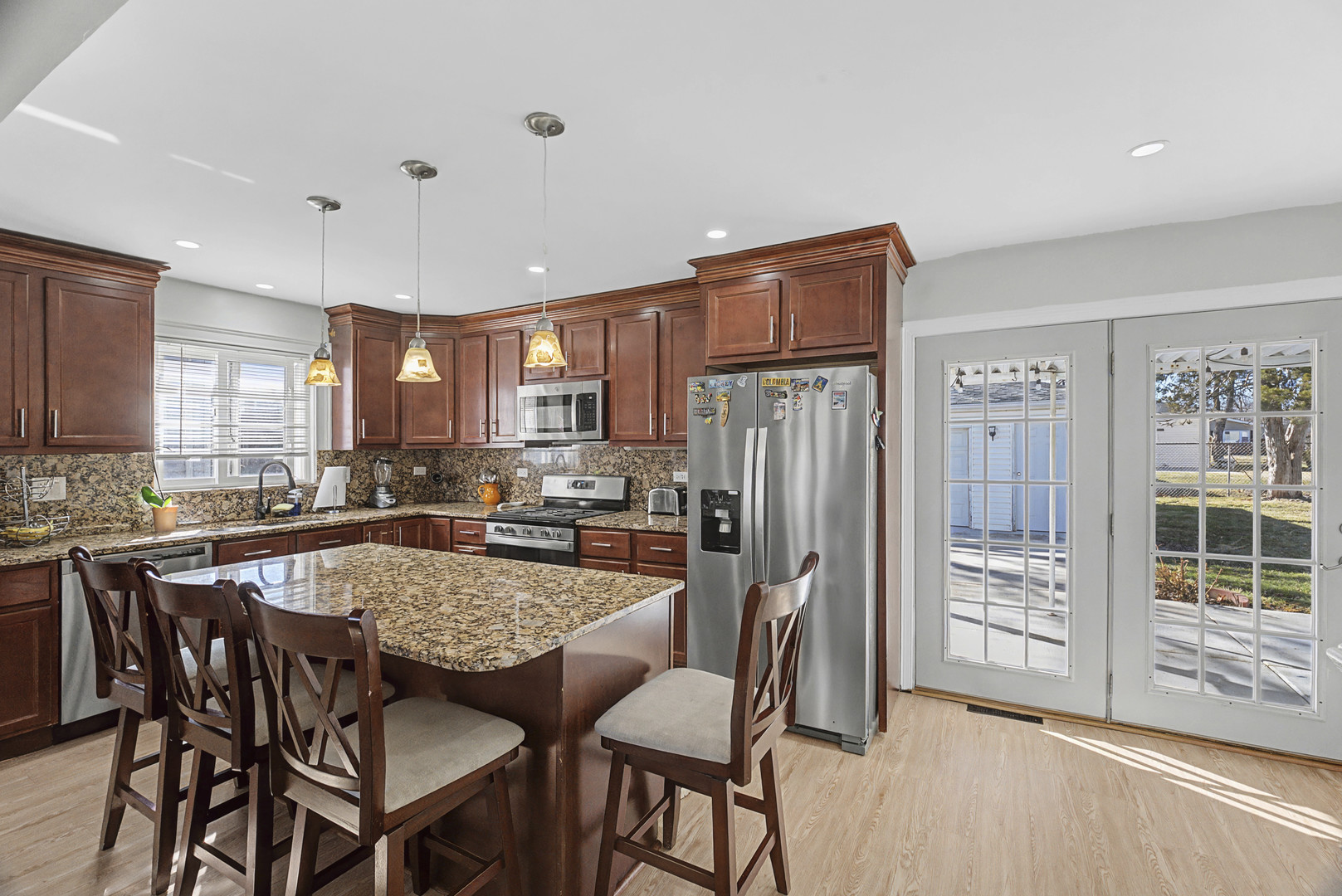 102 South Adeline Avenue Addison, IL 60101 - Photo 5 of 20 a large kitchen with a table and chairs