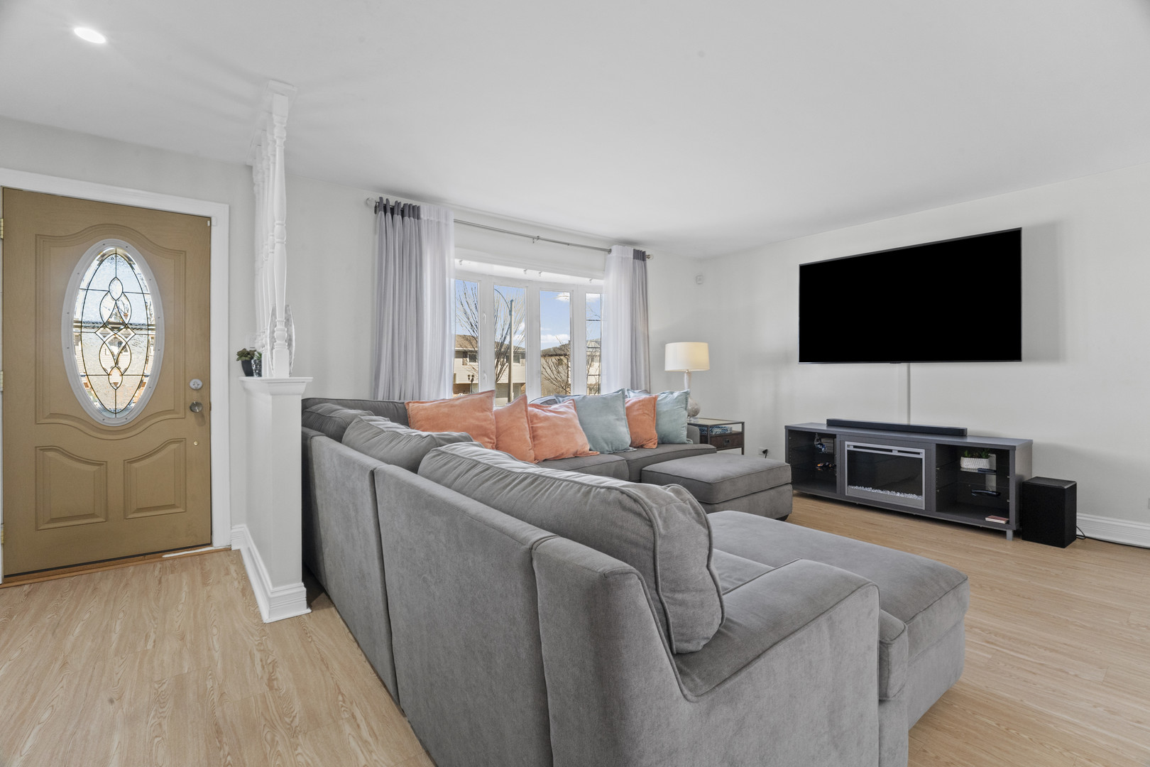 102 South Adeline Avenue Addison, IL 60101 - Photo 8 of 20 a living room with furniture and a flat screen tv