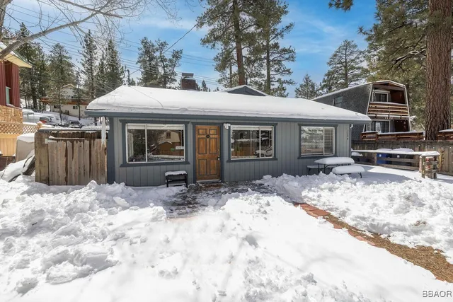 a view of a house with snow on the floor