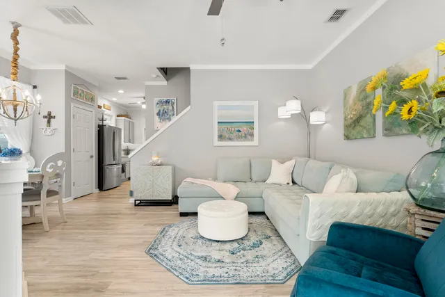 a living room with furniture and a rug