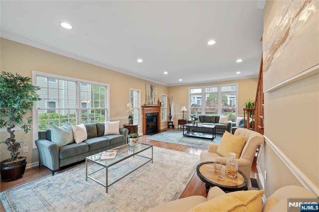 26 Chestnut Court Cedar Grove, NJ 07009 - Photo 2 of 42 a living room with furniture and a large window