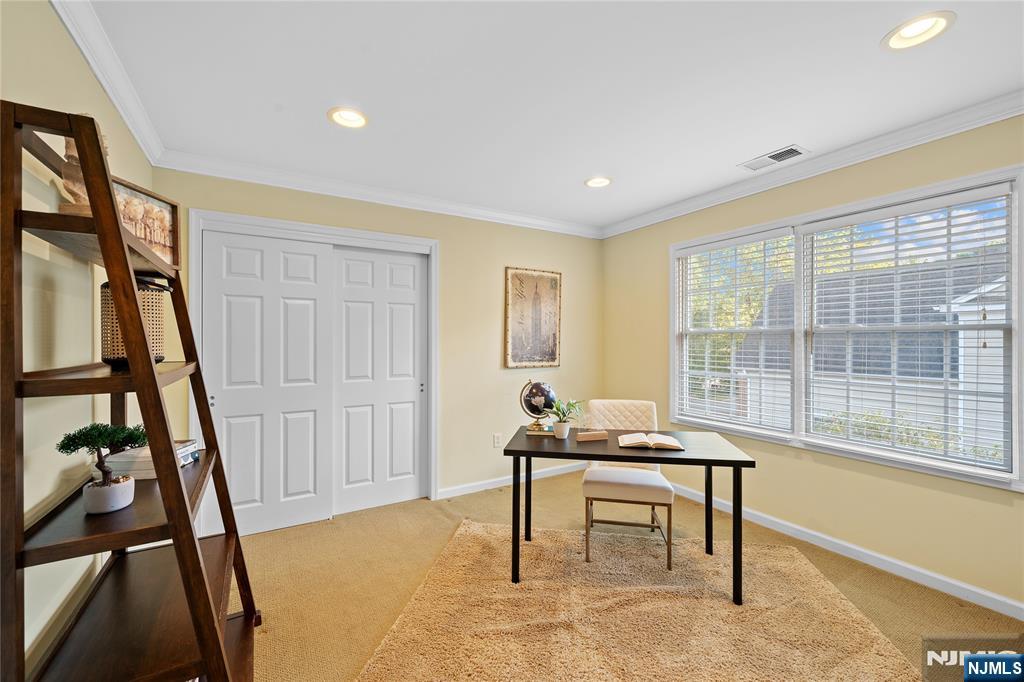 26 Chestnut Court Cedar Grove, NJ 07009 - Photo 28 of 42 a living room with furniture and a window