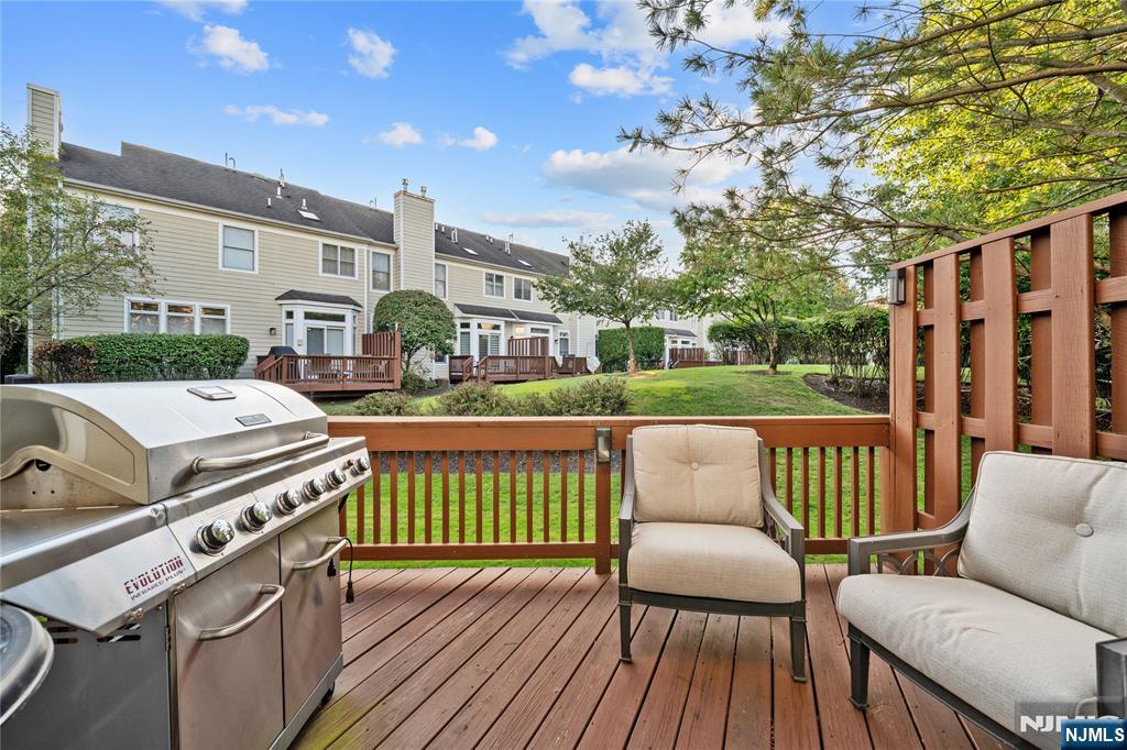 26 Chestnut Court Cedar Grove, NJ 07009 - Photo 34 of 42 a view of a patio with couches chairs and wooden floor