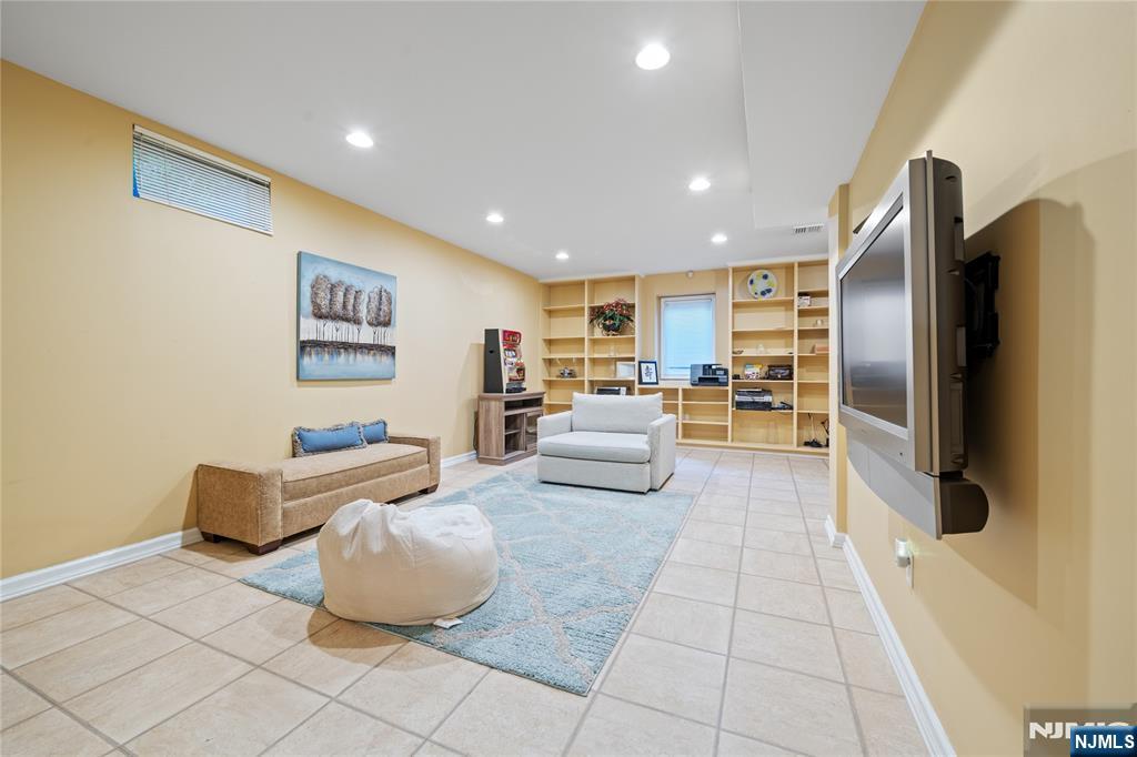 26 Chestnut Court Cedar Grove, NJ 07009 - Photo 39 of 42 a living room with couches and kitchen view