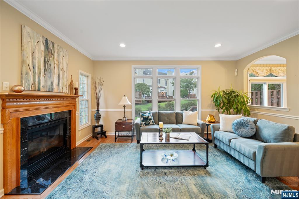 26 Chestnut Court Cedar Grove, NJ 07009 - Photo 4 of 42 a living room with furniture and a fireplace