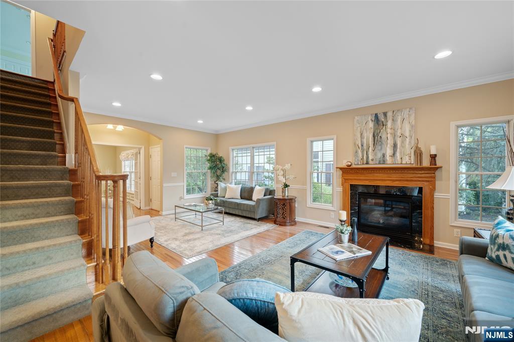 26 Chestnut Court Cedar Grove, NJ 07009 - Photo 5 of 42 a living room with furniture and a fireplace