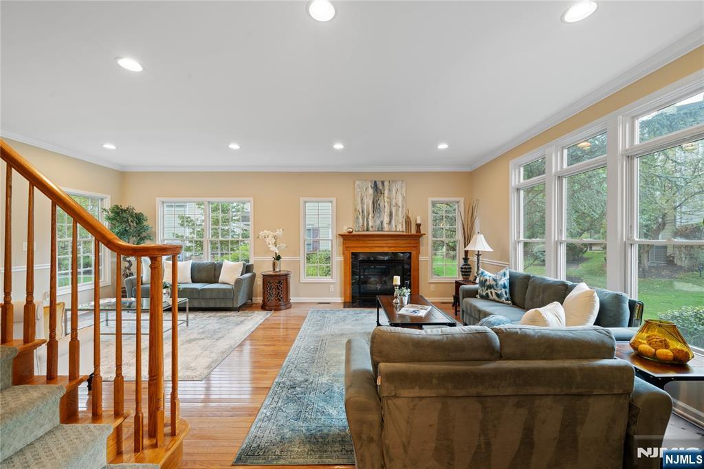 26 Chestnut Court Cedar Grove, NJ 07009 - Photo 7 of 42 a living room with furniture and a fireplace