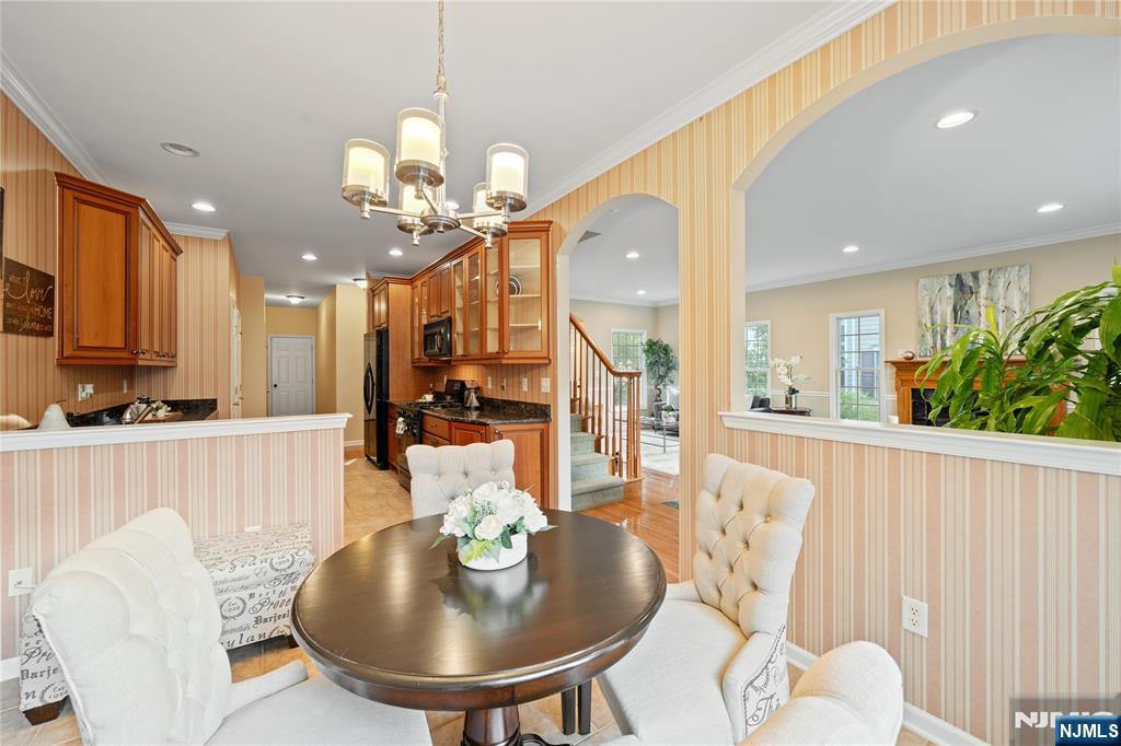 26 Chestnut Court Cedar Grove, NJ 07009 - Photo 8 of 42 a view of a dining room with furniture and wooden floor