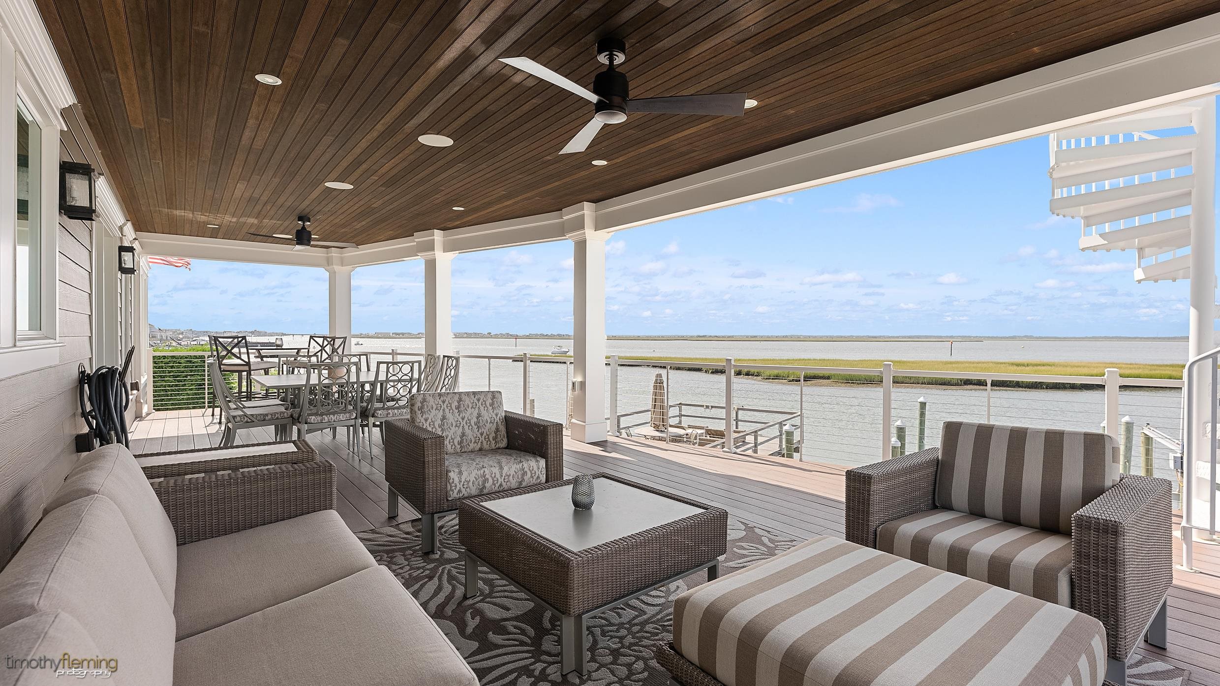 7668 Sunset Drive Avalon, NJ 08202 - Photo 12 of 49 a living room with furniture and a floor to ceiling window