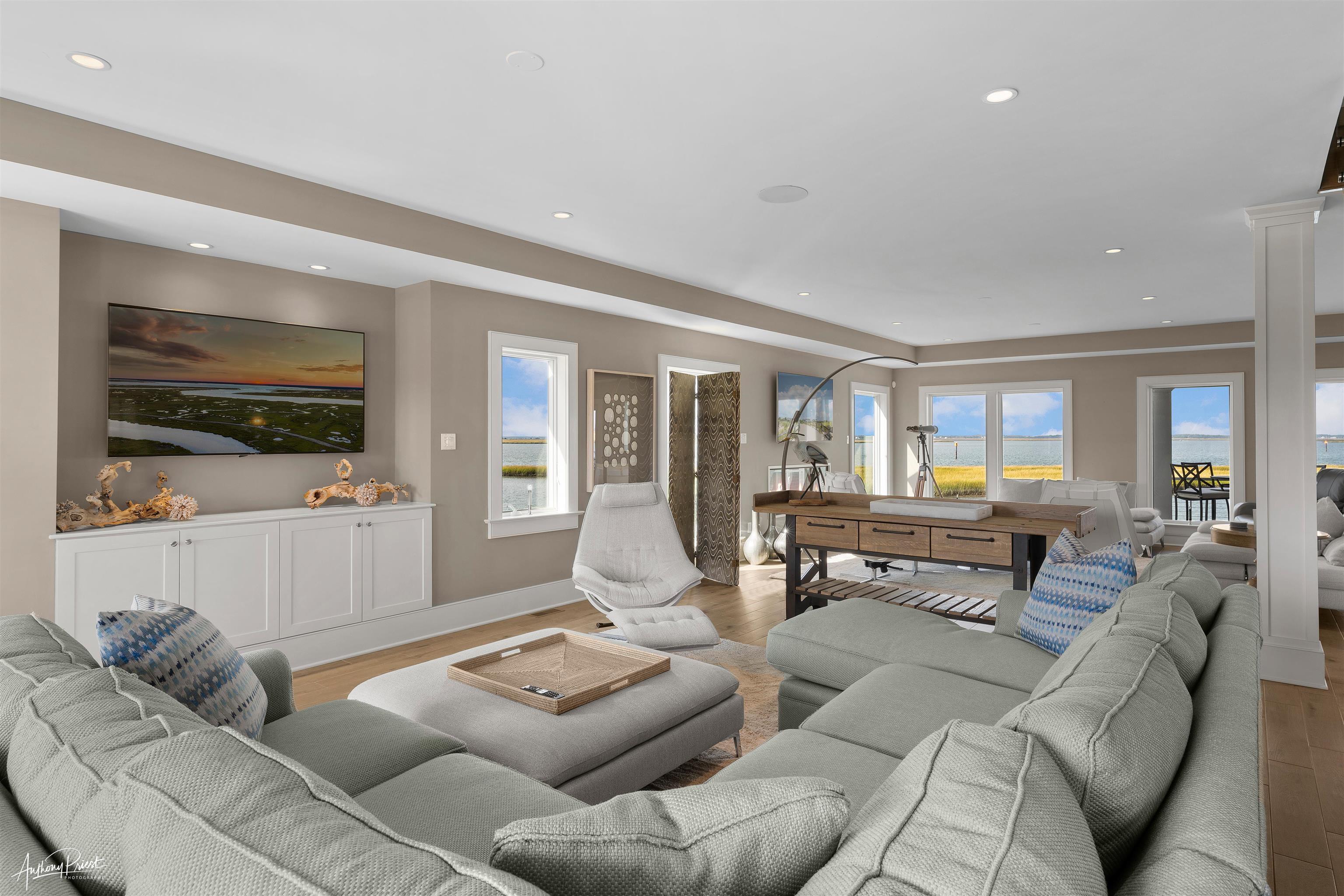 7668 Sunset Drive Avalon, NJ 08202 - Photo 18 of 49 a living room with furniture and a flat screen tv