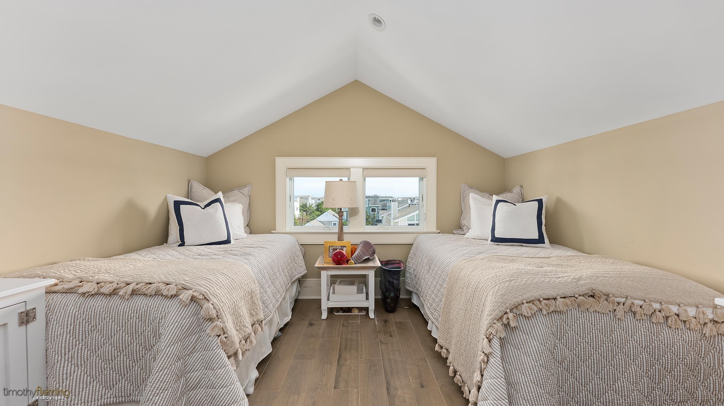 7668 Sunset Drive Avalon, NJ 08202 - Photo 43 of 49 a bedroom with bed and a window