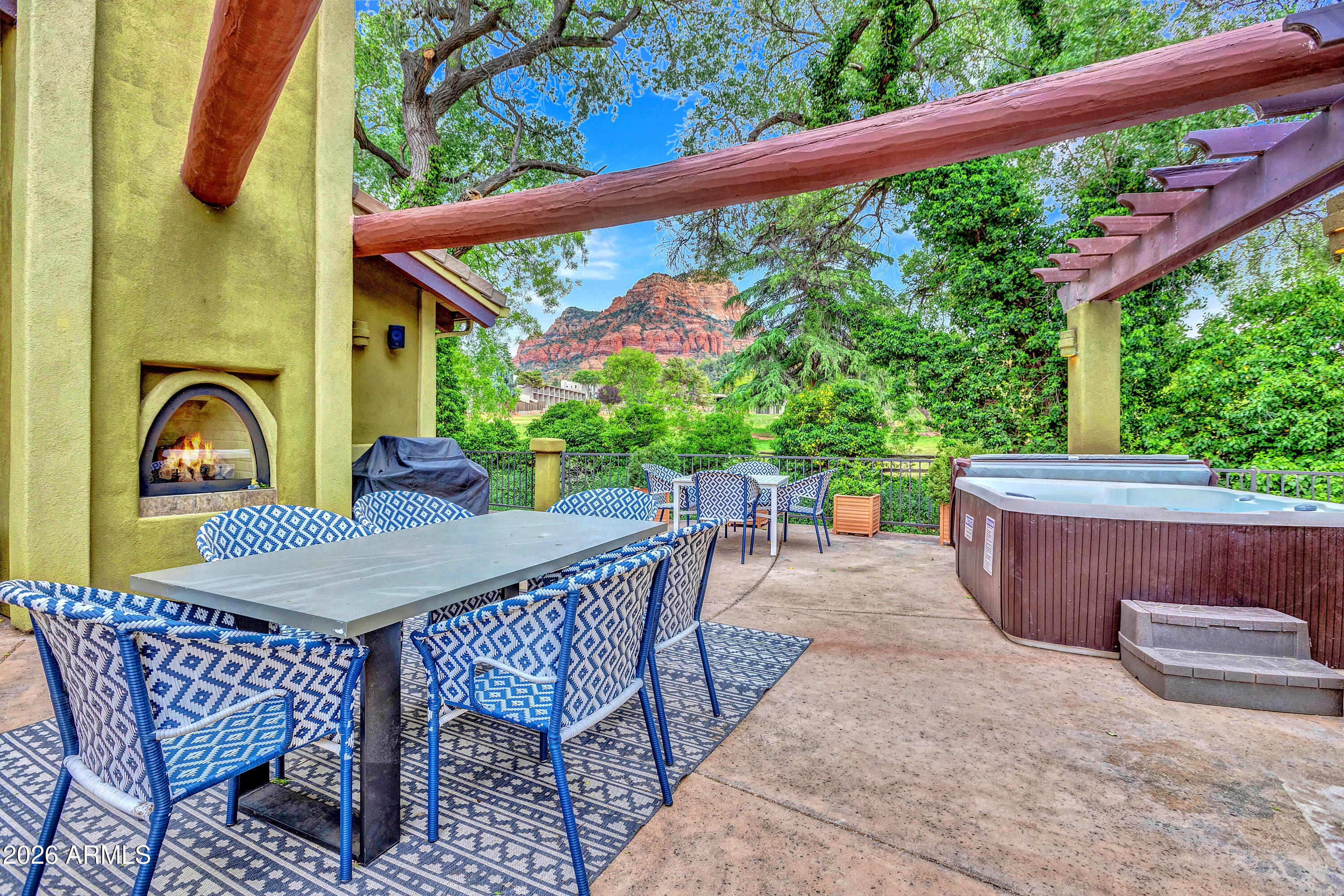55 Ranch House Circle Sedona, AZ 86336 - Photo 3 of 61 a view of a patio with a table and chairs