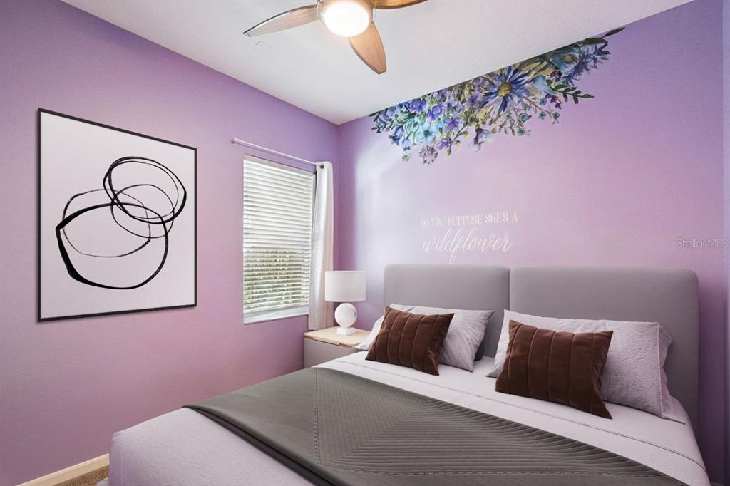 8484 Dover View Lane Orlando, FL 32829 - Photo 13 of 41 a bedroom with a bed and a chandelier