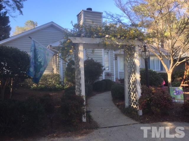 2758 Rue Sans Famille Raleigh, NC 27607 - Photo 3 of 12 a view of a house with yard and tree s