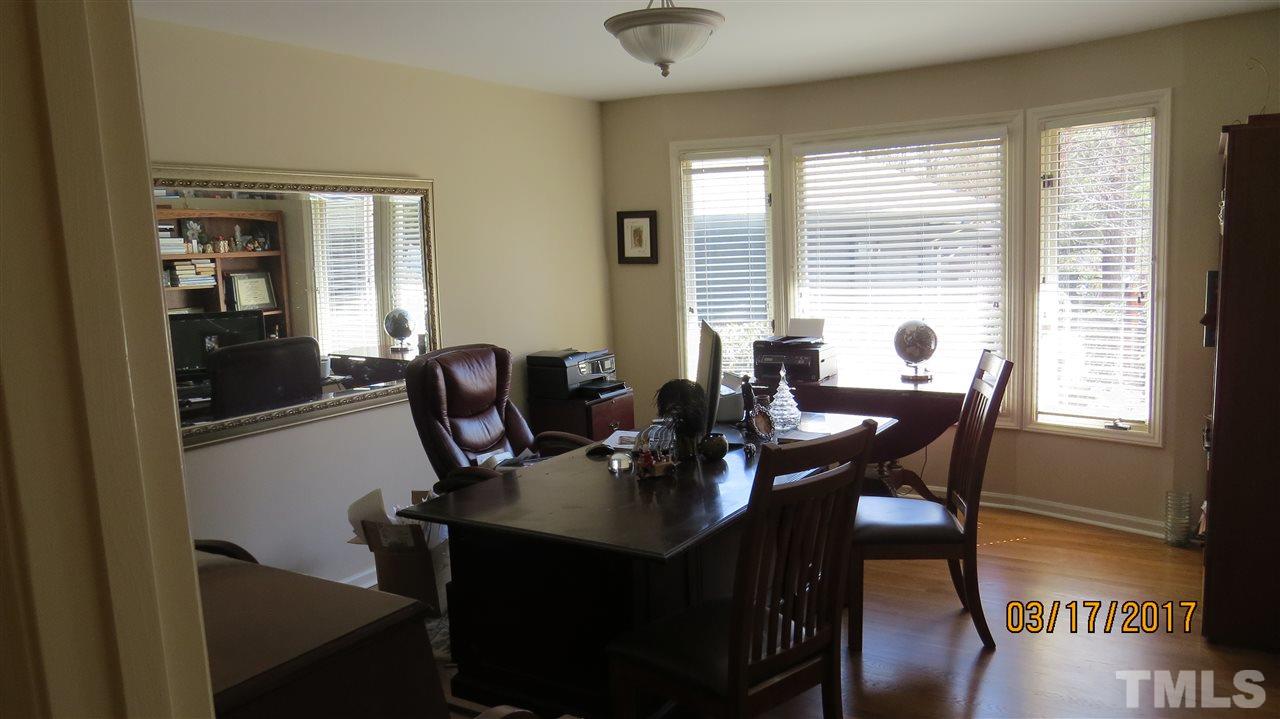 2758 Rue Sans Famille Raleigh, NC 27607 - Photo 8 of 12 a view of a dining room with furniture and wooden floor