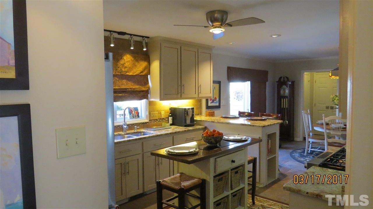 2758 Rue Sans Famille Raleigh, NC 27607 - Photo 9 of 12 a view of a dining room with furniture and window