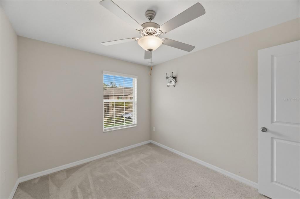 8606 Reedville Street New Port Richey, FL 34654 - Photo 35 of 100 a view of an empty room with a window