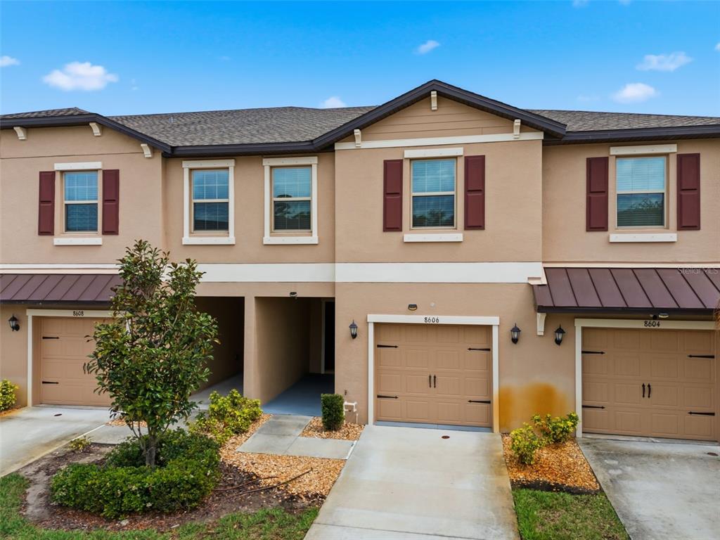 8606 Reedville Street New Port Richey, FL 34654 - Photo 58 of 100 a front view of a house with a yard