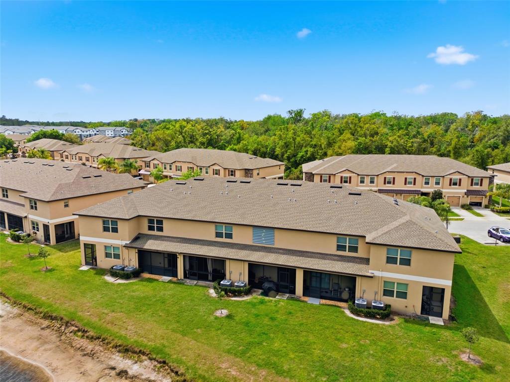 8606 Reedville Street New Port Richey, FL 34654 - Photo 68 of 100 an aerial view of residential houses with yard and ocean view
