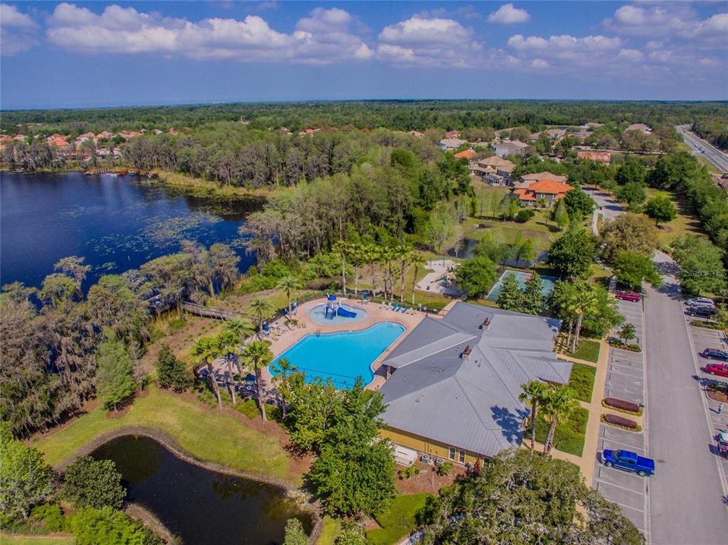 8606 Reedville Street New Port Richey, FL 34654 - Photo 91 of 100 an aerial view of residential houses with outdoor space and lake view
