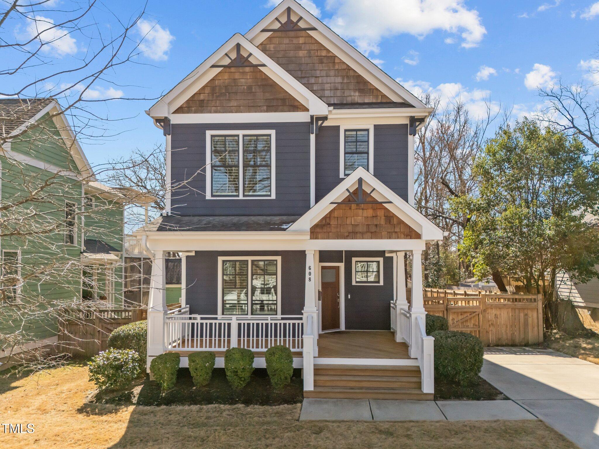 608 Dowd Street Durham, NC 27701 - Photo 1 of 24 a front view of a house with a garden