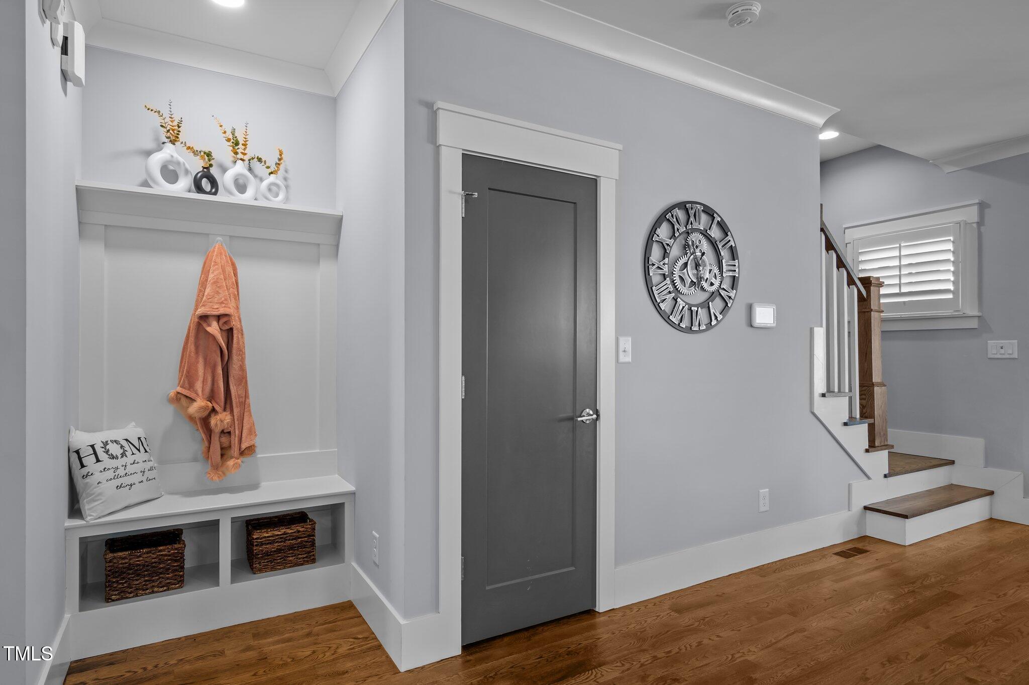 608 Dowd Street Durham, NC 27701 - Photo 4 of 24 a view of a hallway with paintings on the wall