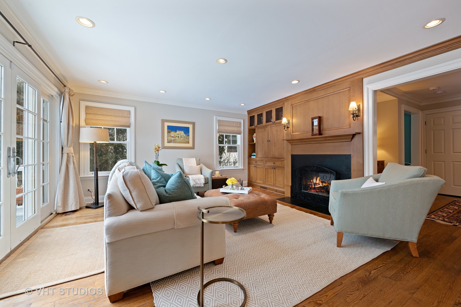 1075 Elm Street Winnetka, IL 60093 - Photo 11 of 40 a living room with furniture and a fireplace
