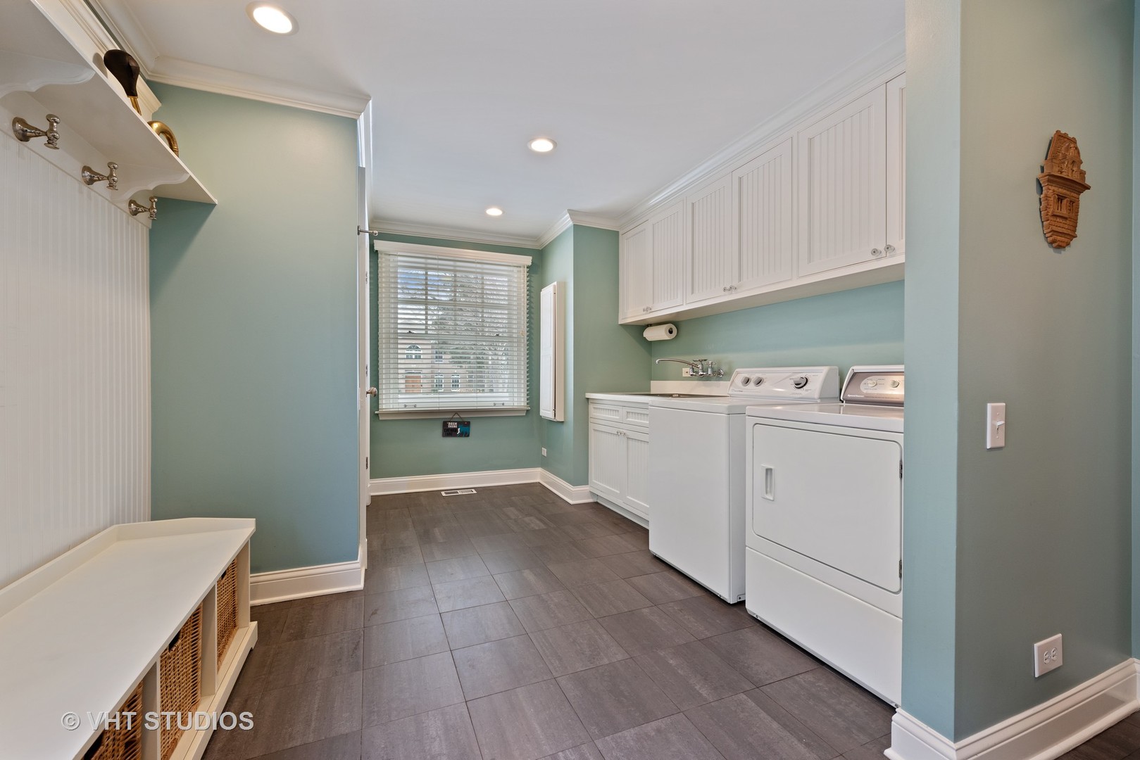 1075 Elm Street Winnetka, IL 60093 - Photo 15 of 40 a room with a white cabinets sink and a window