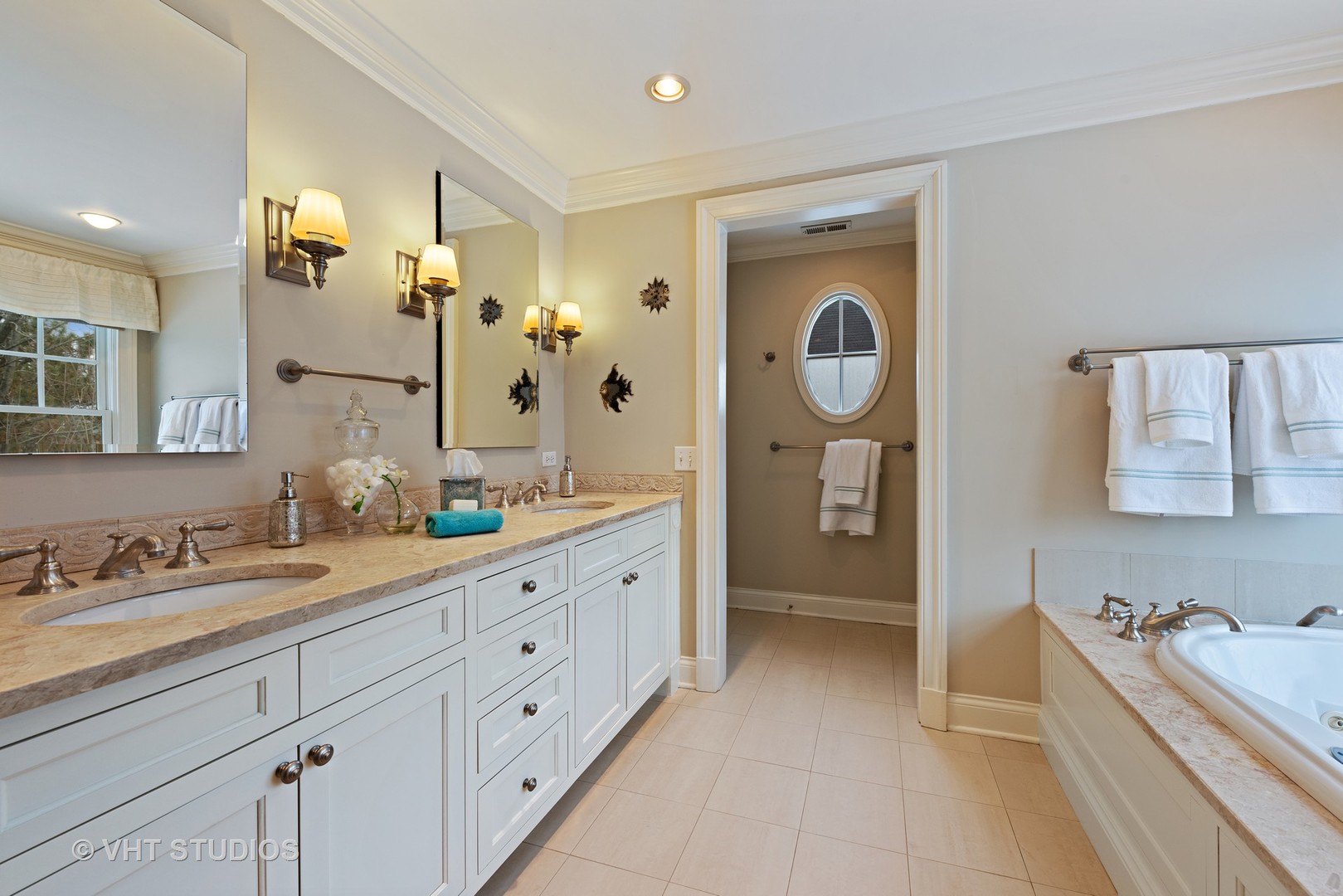 1075 Elm Street Winnetka, IL 60093 - Photo 20 of 40 a spacious bathroom with a double vanity sink mirror and bathtub