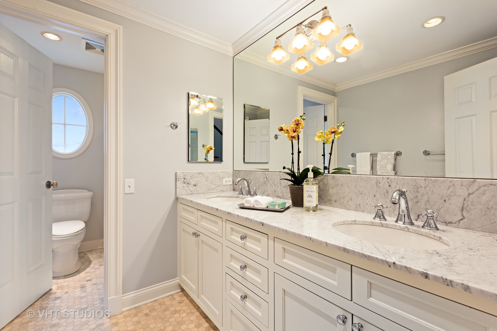 1075 Elm Street Winnetka, IL 60093 - Photo 26 of 40 a bathroom with a granite countertop double vanity sink and a mirror