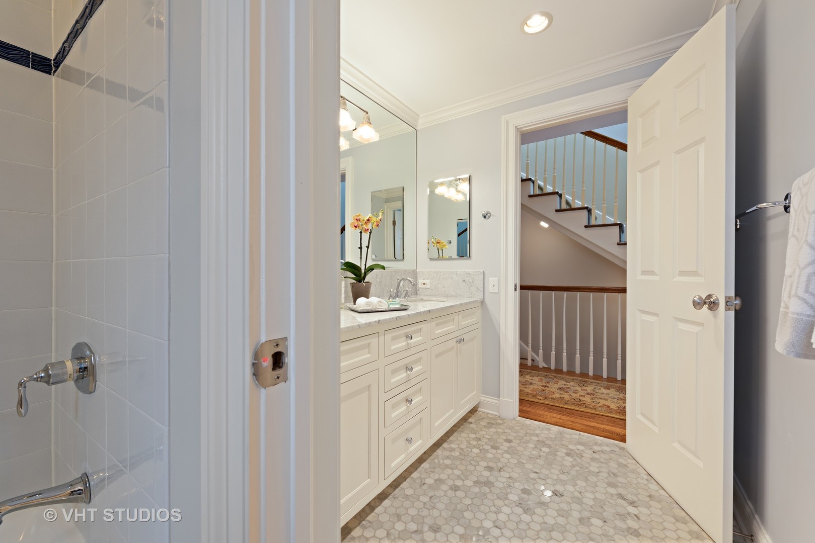1075 Elm Street Winnetka, IL 60093 - Photo 27 of 40 a spacious bathroom with a shower and a sink