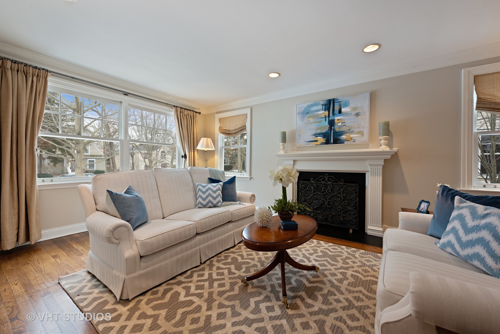 1075 Elm Street Winnetka, IL 60093 - Photo 4 of 40 a living room with furniture and a fireplace