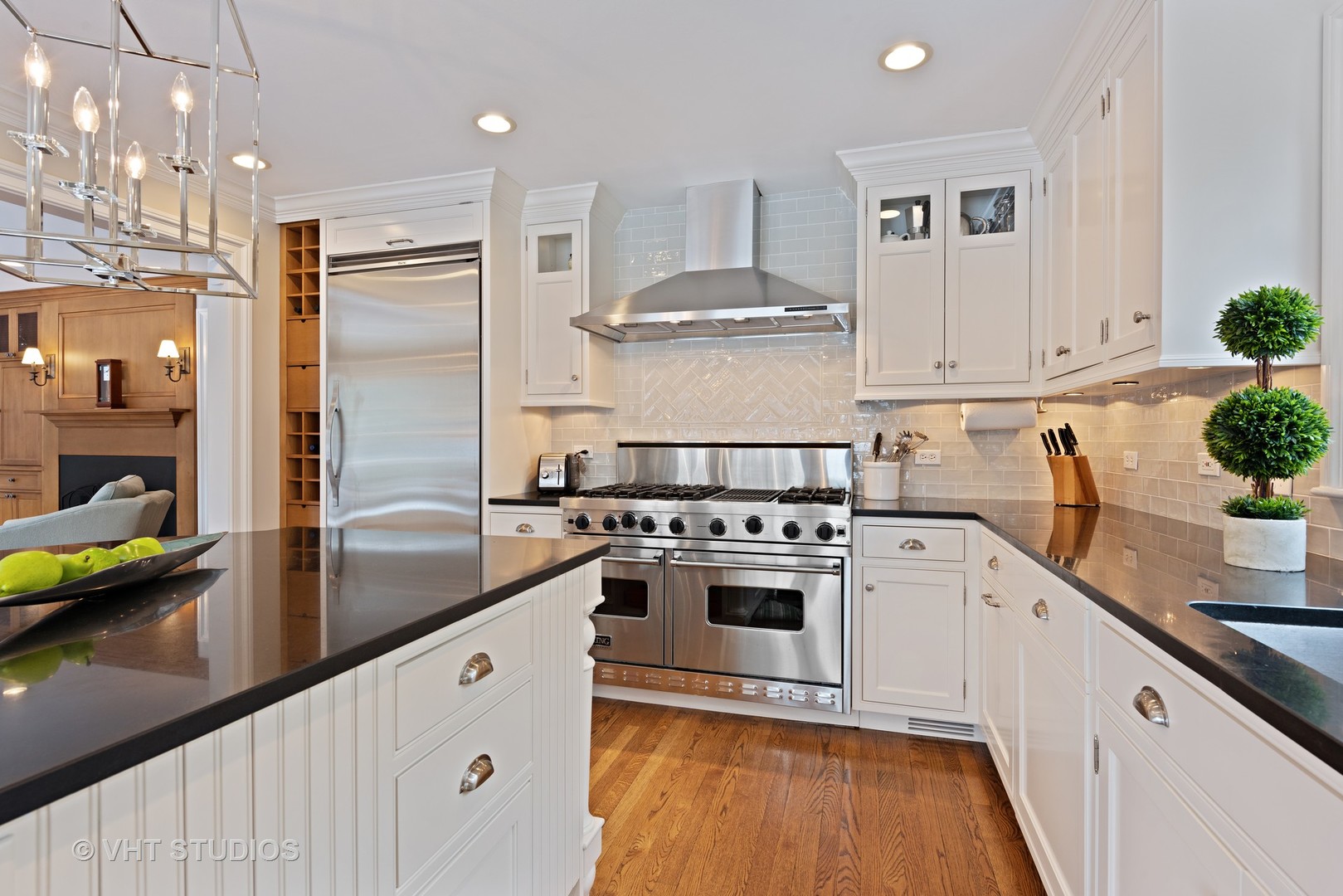 1075 Elm Street Winnetka, IL 60093 - Photo 9 of 40 a kitchen with stainless steel appliances granite countertop a sink a stove and a refrigerator