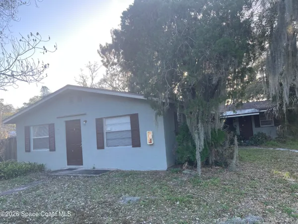 a backyard of a house with lots of green space