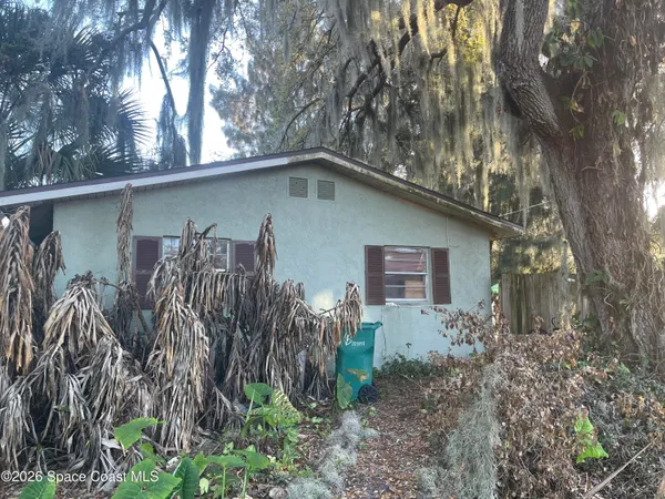 a backyard of a house with lots of green space