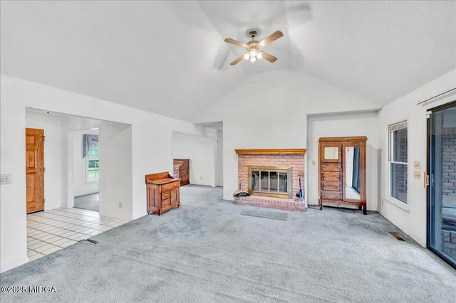 a view of living room with furniture and window