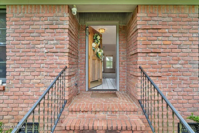 a view of a balcony with a potted plant