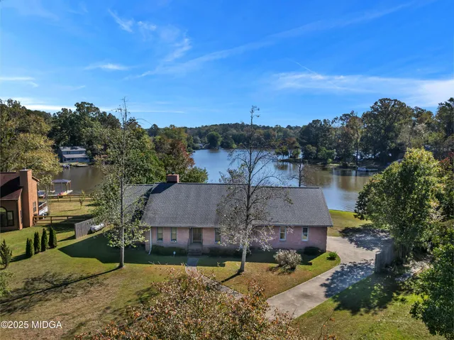 an aerial view of residential house with outdoor space