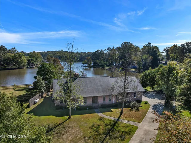 a view of a patio with table and chairs