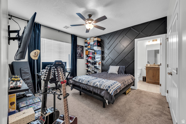 6105 Bunda Way St. George, UT 84790 - Photo 28 of 49 Bedroom featuring a striking black accent wall with geometric paneling