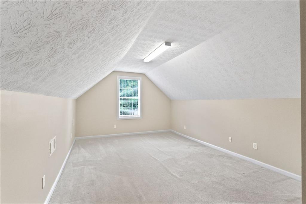 241 Red Bud Road Jefferson, GA 30549 - Photo 38 of 43 an empty room with windows and closet