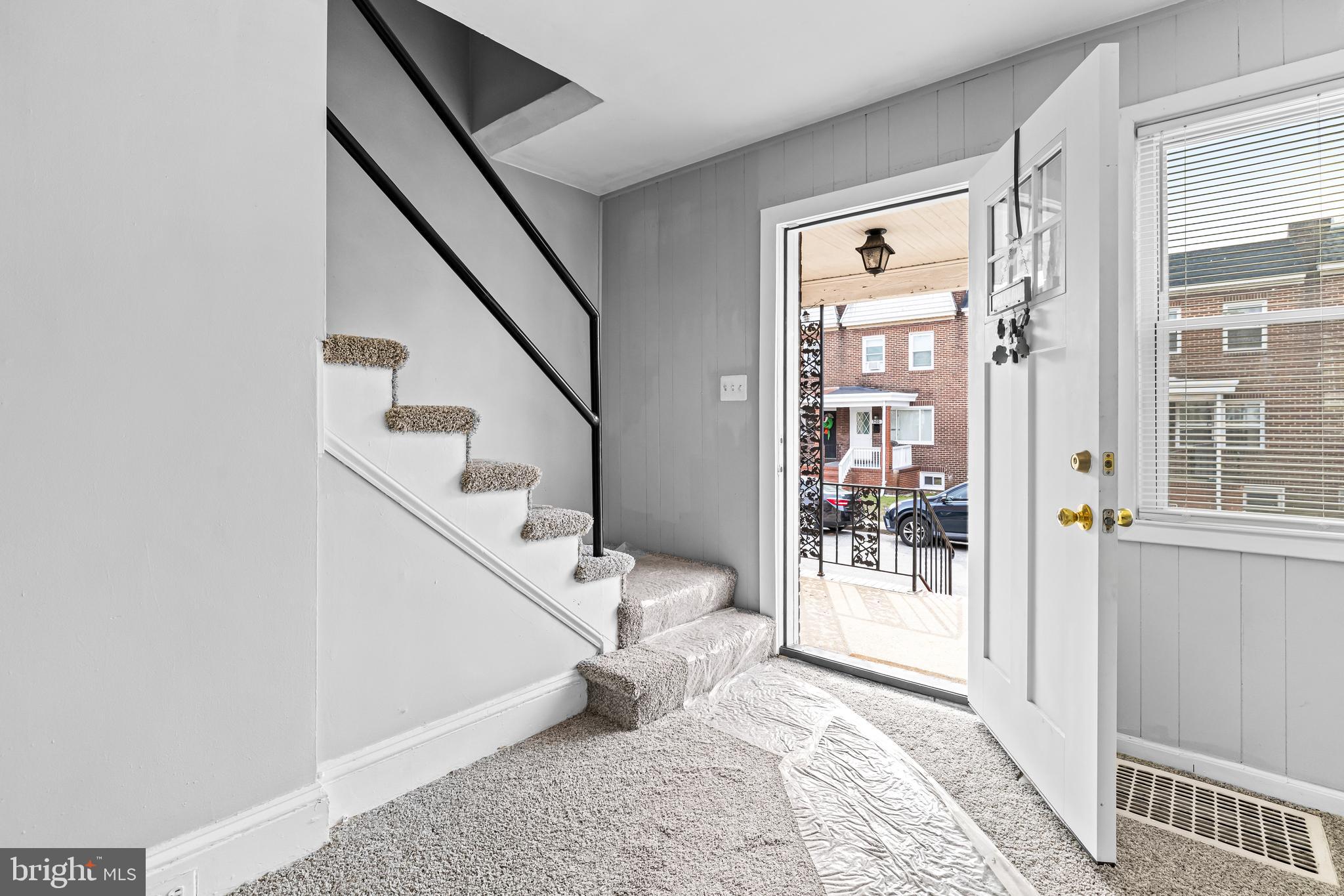 a view of entryway with bedroom and wooden floor