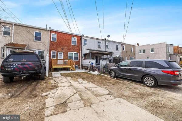 a view of a cars parked in front of a house