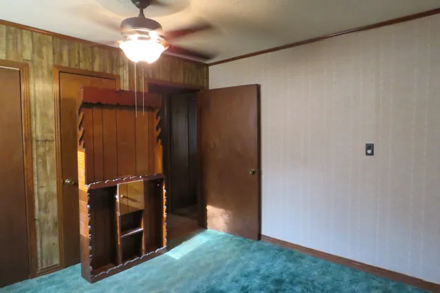 a bathroom with a sink a mirror and a window